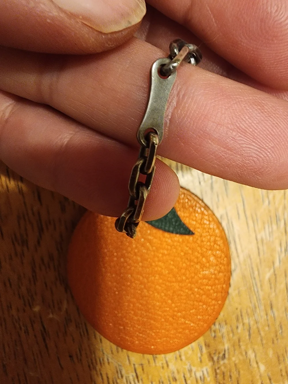 authentic Hermès orange fruit leather bag charm and keychain